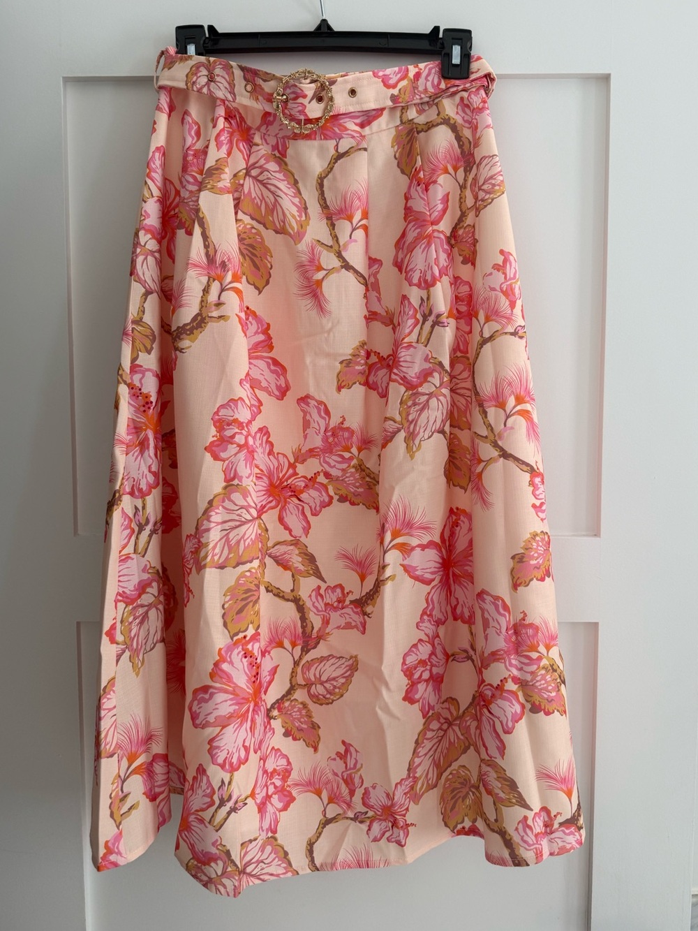 Cecelia 
The label.  Peach Floral Midi Skirt.  Size Small